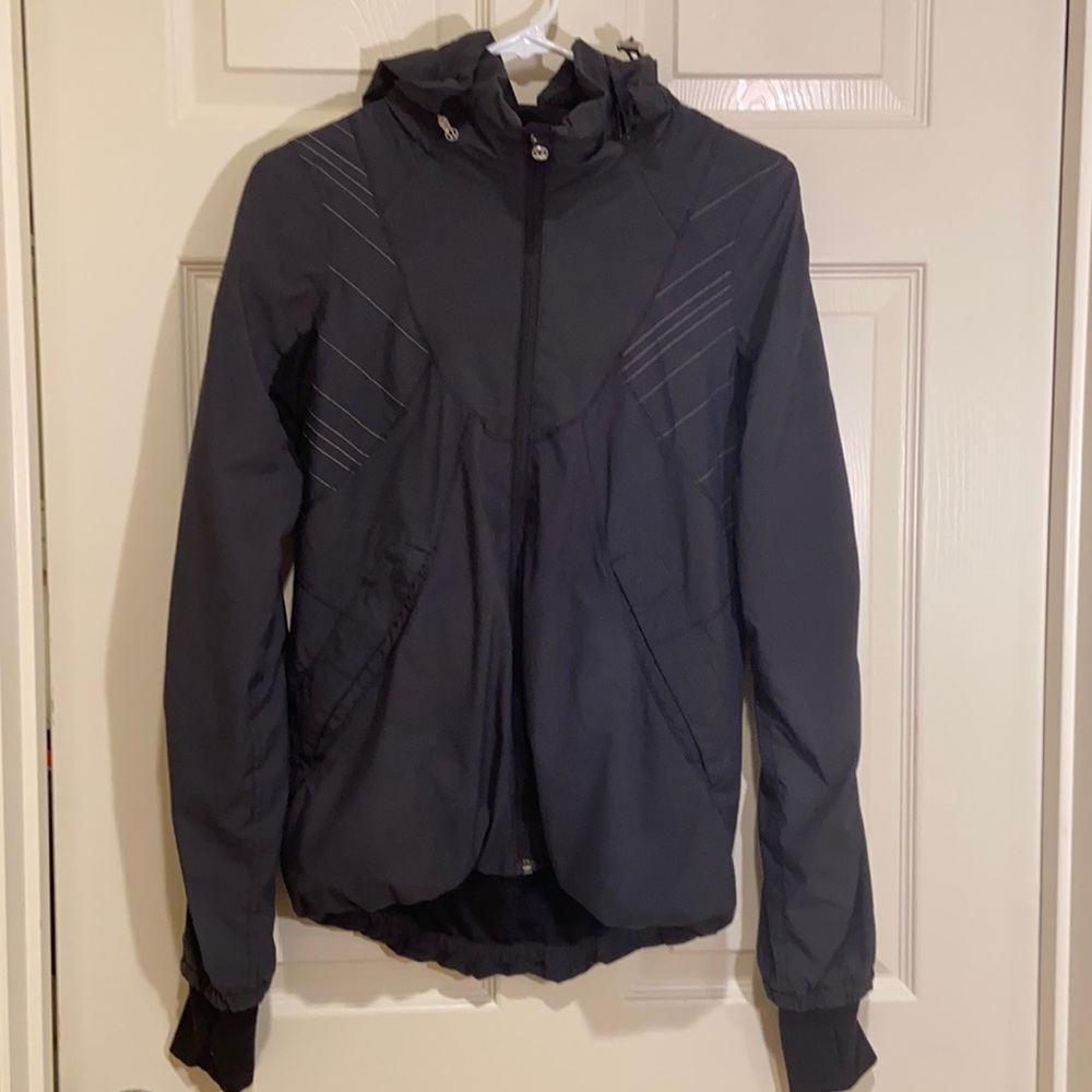 Lined Lululemon rain jacket with ruffled detail.